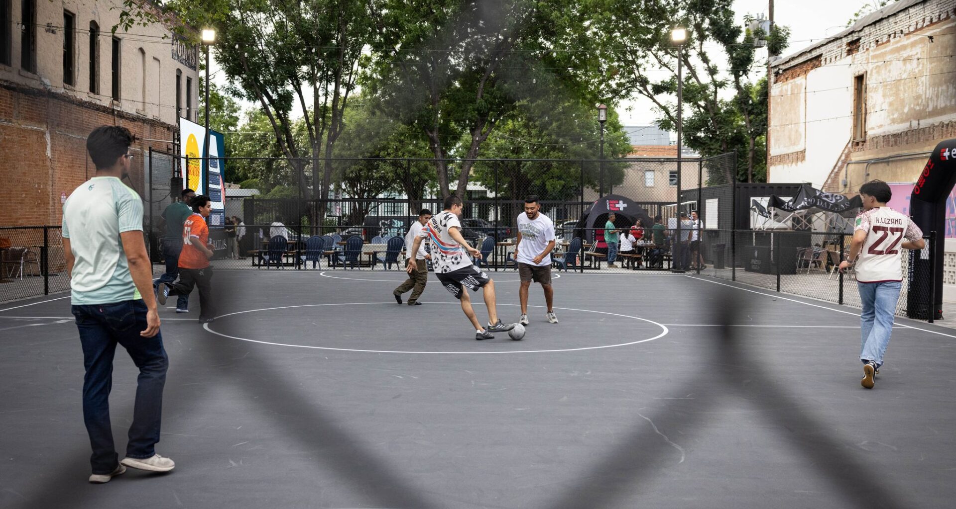Men play soccer in an outdoor court across the street from Fair Park, owned by  Atlético Dallas, after the World Cup in Dallas, Thursday, June 11, 2026.