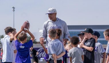 Graham Harrell talks to fans during a team gathering at a donor's house in Abilene in April 2026.
