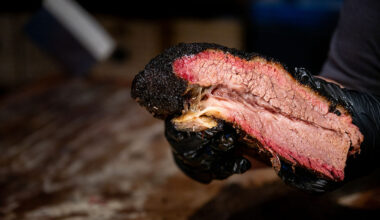 An employee showcases a brisket at a Terry Black's Barbecue restaurant on May 27, 2026 in Lockhart, Texas.