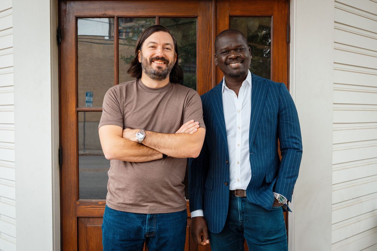 Chef Aaron Bludorn and Cherif Mbodji outside of Liberty Saloon building.