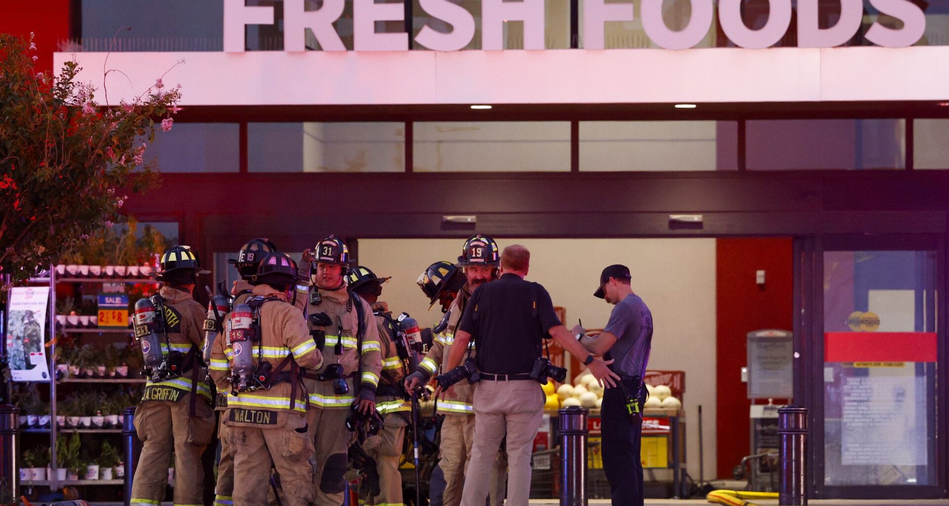 Fort Worth Fire Department firefighters gather outside H-E-B Alliance as they respond to a fire at the grocery store on Thursday, July 9, 2026, in Fort Worth.