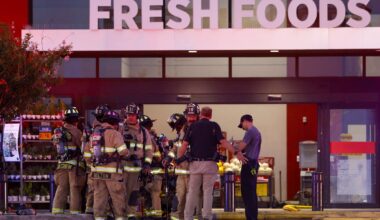 Fort Worth Fire Department firefighters gather outside H-E-B Alliance as they respond to a fire at the grocery store on Thursday, July 9, 2026, in Fort Worth.