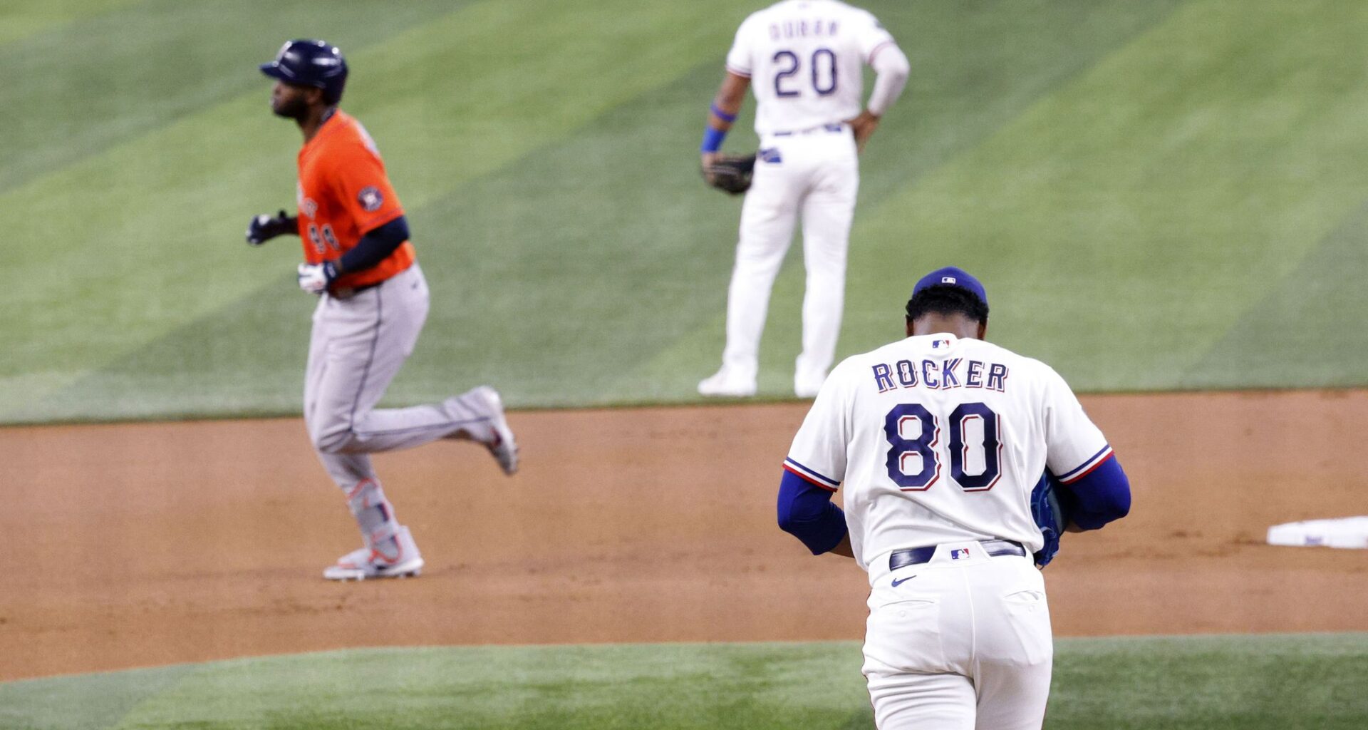 Texas Rangers center fielder Evan Carter (32) is tagged out by Houston Astros shortstop Jeremy Peña (3) during the seventh inning of a baseball game at Globe Life Field, Saturday, July 11, 2026, in Arlington.