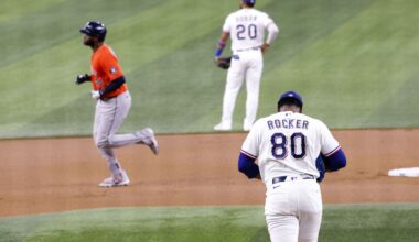Texas Rangers center fielder Evan Carter (32) is tagged out by Houston Astros shortstop Jeremy Peña (3) during the seventh inning of a baseball game at Globe Life Field, Saturday, July 11, 2026, in Arlington.
