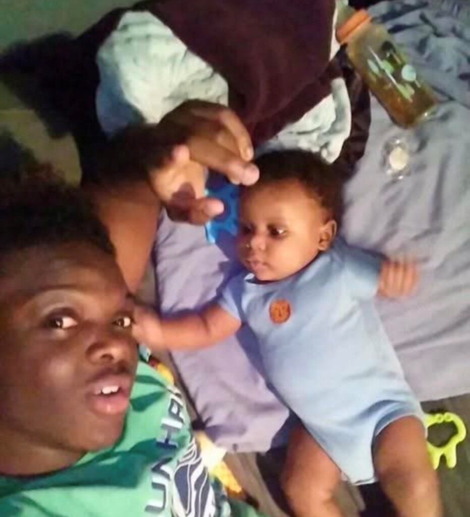 Kealon Gilmore, who was killed in a 2022 outdoor concert shooting in Dallas, with his son. 