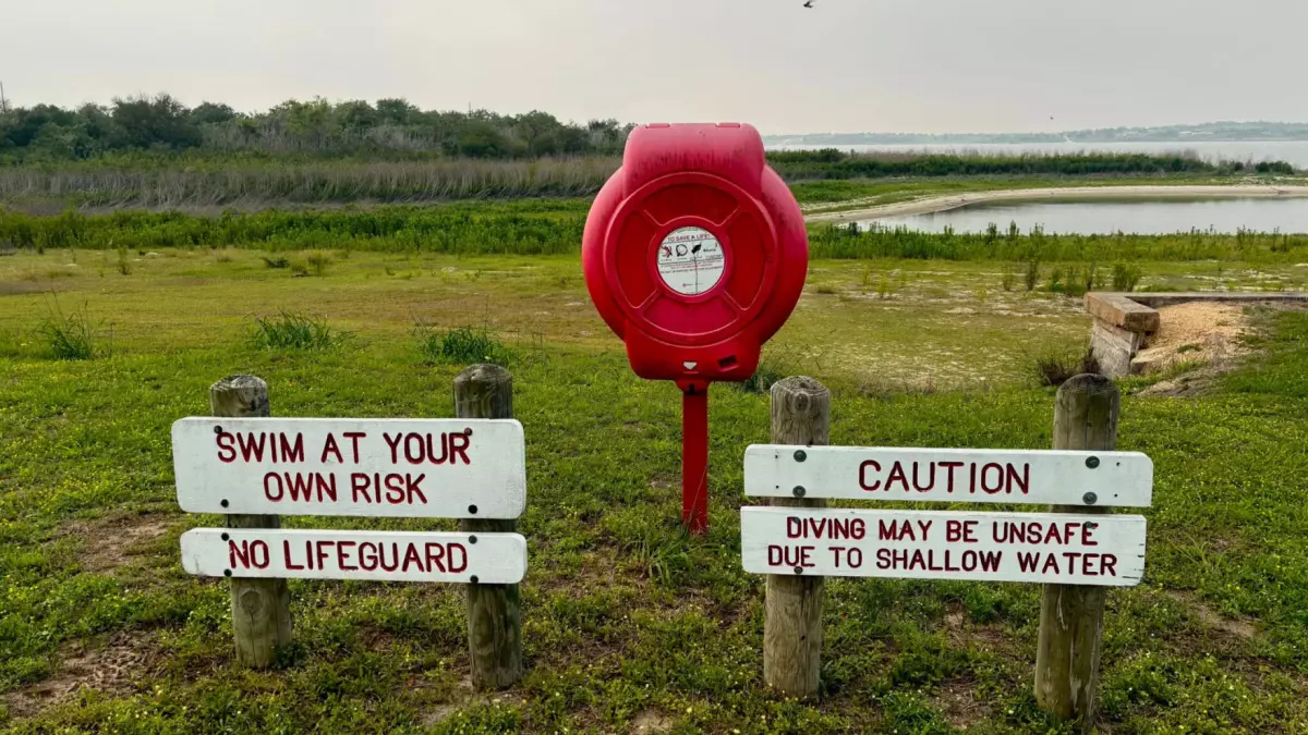 Lake Corpus Christi dropped below 10% full in March, the lowest on record since it was first filled in the late 1950s. Signs about swimming sit far from the water's edge as of this April 28 photo.