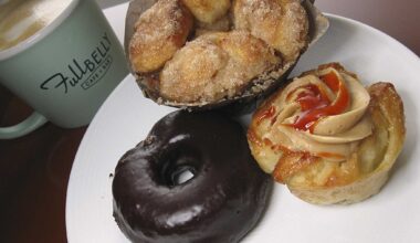 Baked goods made in-house include a chocolate doughnut, cinnamon-sugar monkey bread and a puff pastry with peanut butter cream filling and sriracha syrup at Full Belly Cafe and Bar.