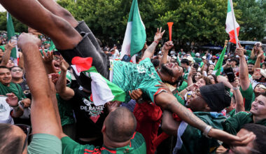 Mexico fans toss a fellow supporter in the air during a watch party at Klyde Warren Park during Mexico’s World Cup match against England on July 5. England won the match 3-2.