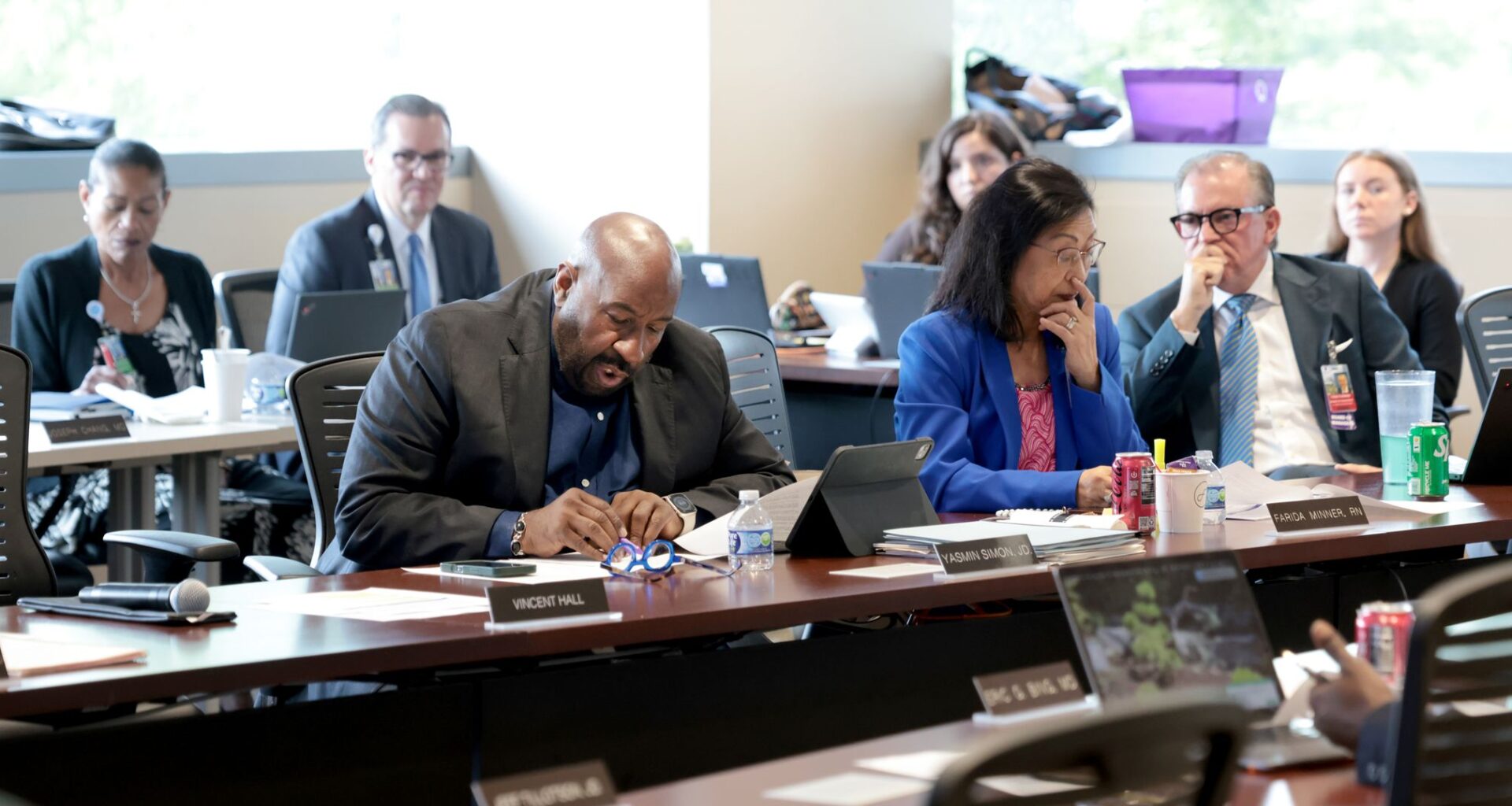 Parkland Hospital’s Board of Managers Chair Vincent Hall (center) reads a resolution before a vote was taken on whether to bail out Metrocare, the area’s largest mental health service provider, from its current financial crisis. The meeting was held at the Parkland Memorial Hospital WISH Clinic, 5200 Harry Hines Blvd., in Dallas on July 13 2026.