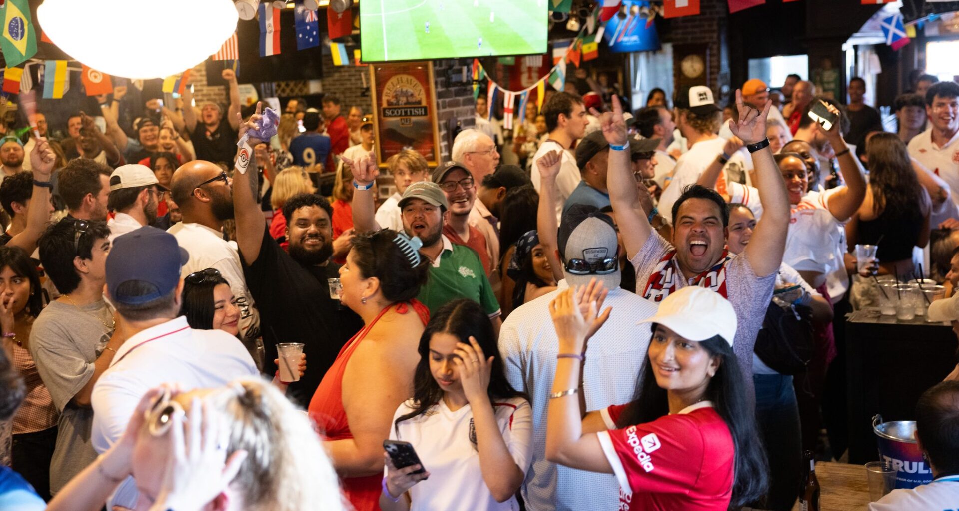 England fans celebrate during a watch party for World Cup match between England and Croatia at The Londoner Pub in Dallas on Wednesday, June 17, 2026. England defeated Croatia 4-2.
