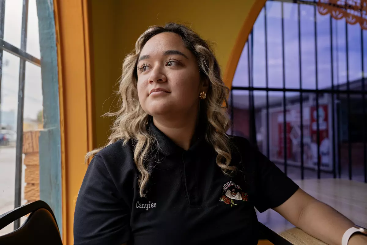Lucinea Canyfer Vazquez poses for a portrait at Monchy's, her family's restaurant in Houston.