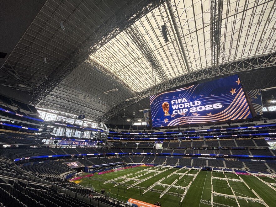 The inside of Dallas Stadium with signs advertising the venue as a host of the FIFA World Cup 2026.