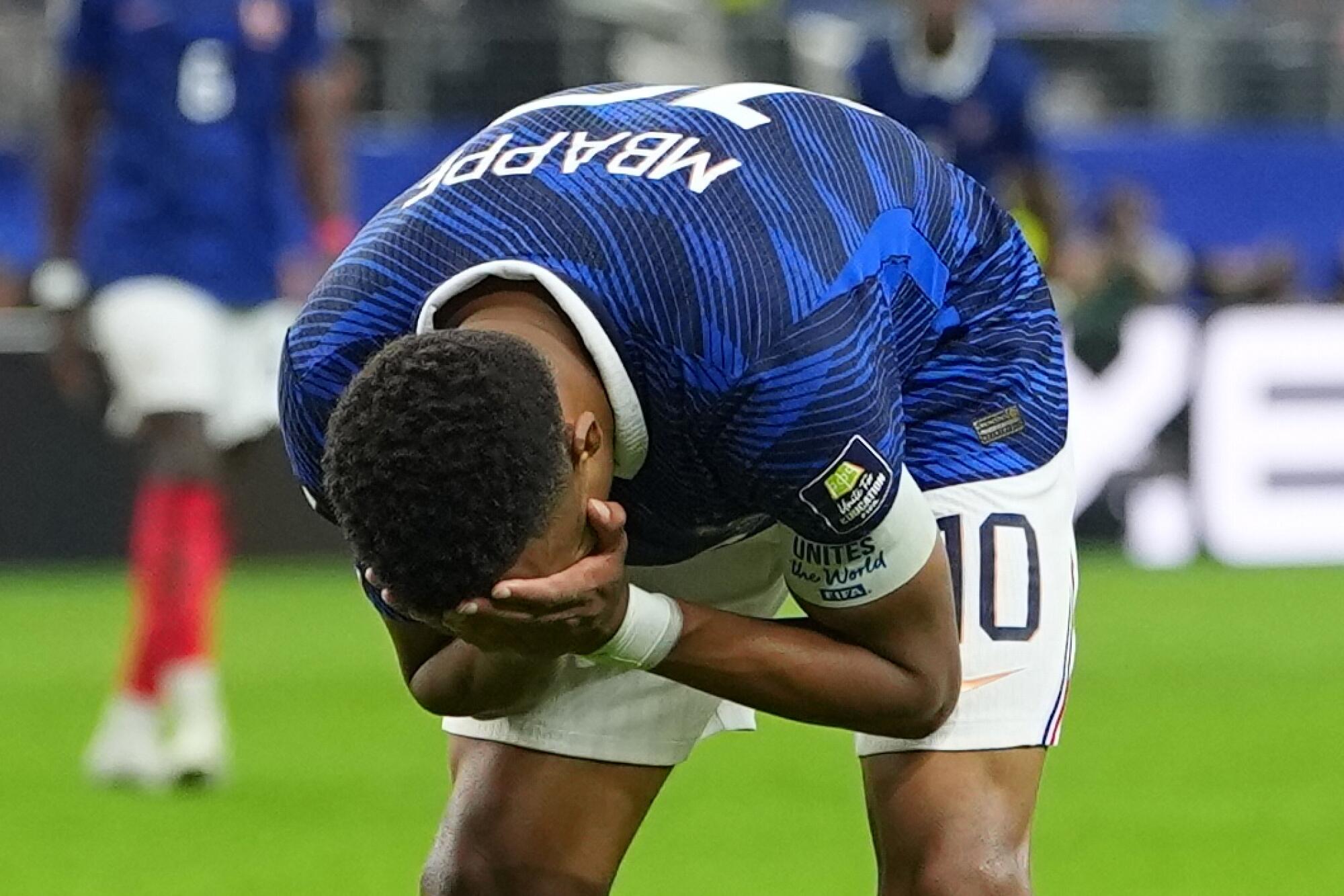 France's Kylian Mbappé reacts after losing to Spain during a World Cup semifinal in Arlington, Texas, on Tuesday.