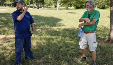 Chris Morris, Dallas Park and Recreation’s urban biologist (left), talks with Dallas resident Dick Morrison while watching bald eagles and their eaglets at White Rock Lake on Thursday, July 9, 2026, in Dallas.