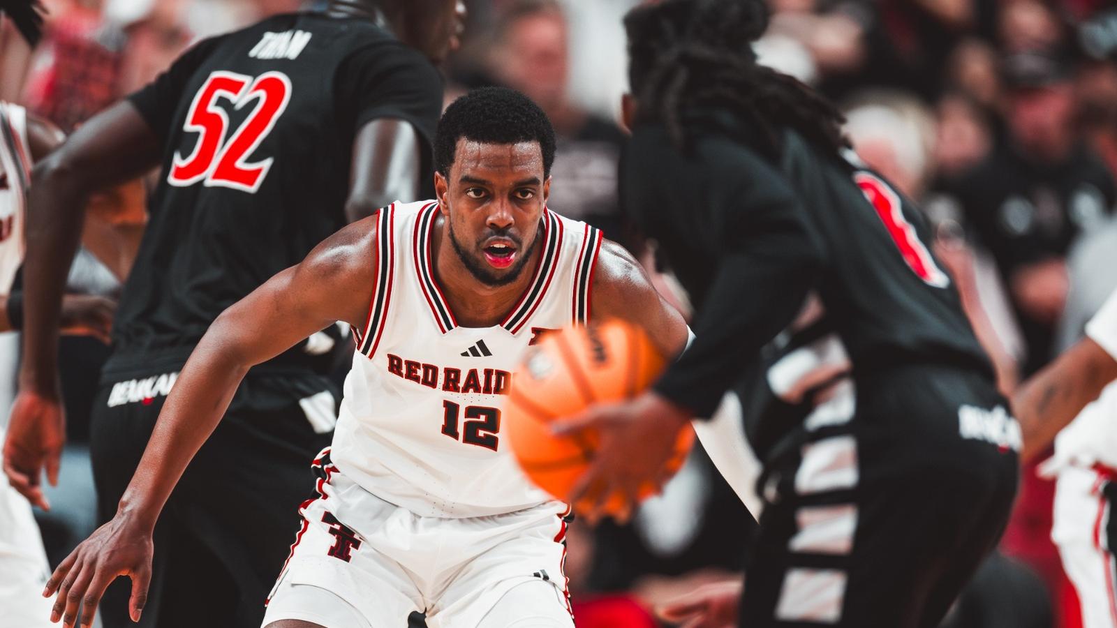Grant McCasland and Donovan Atwell are interviewed by CBS after a win at Iowa State.