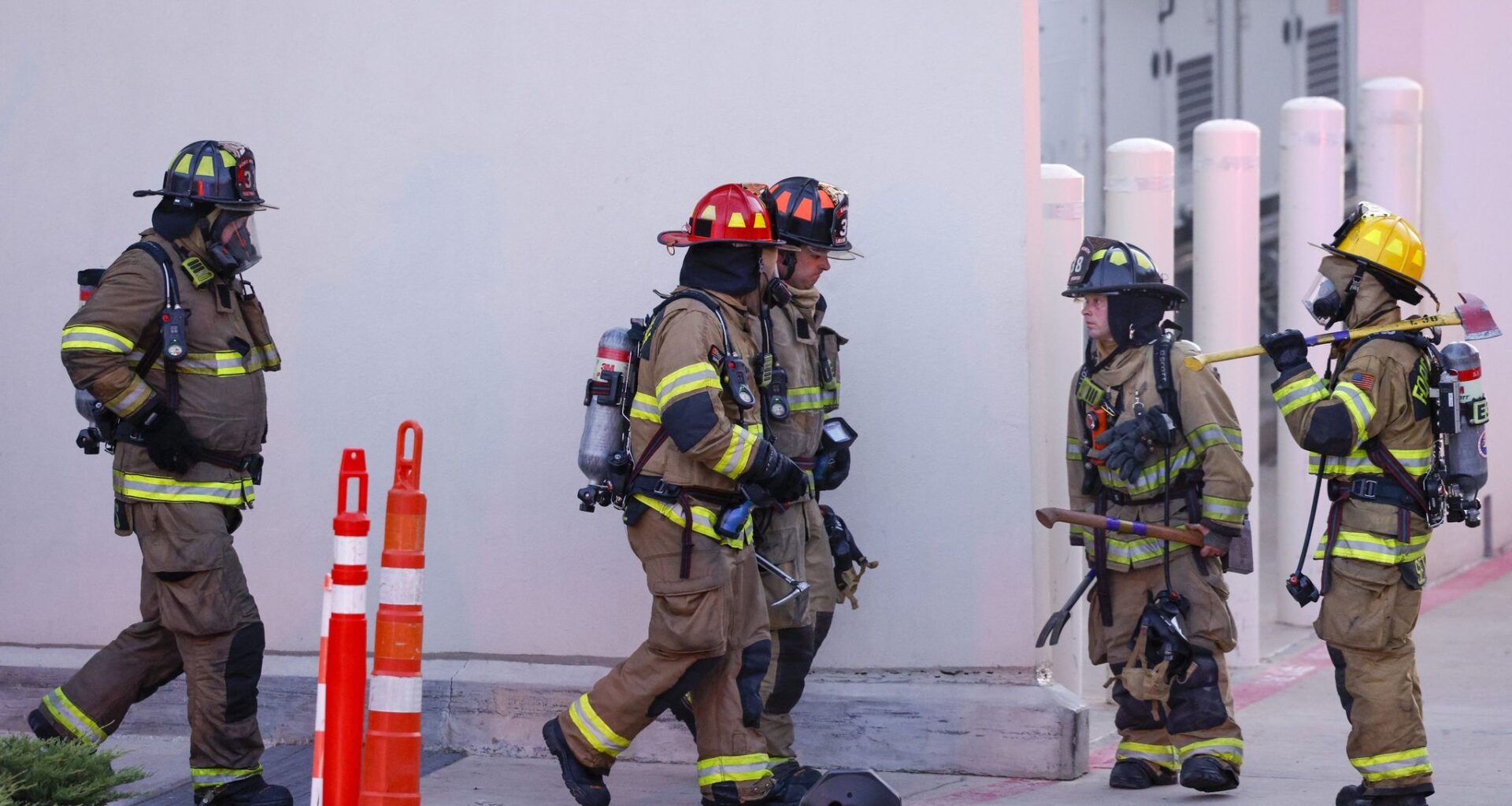 Fort Worth Fire Department firefighters exit H-E-B Alliance as they respond to a fire at the grocery store, Thursday, July 9, 2026, in Fort Worth.