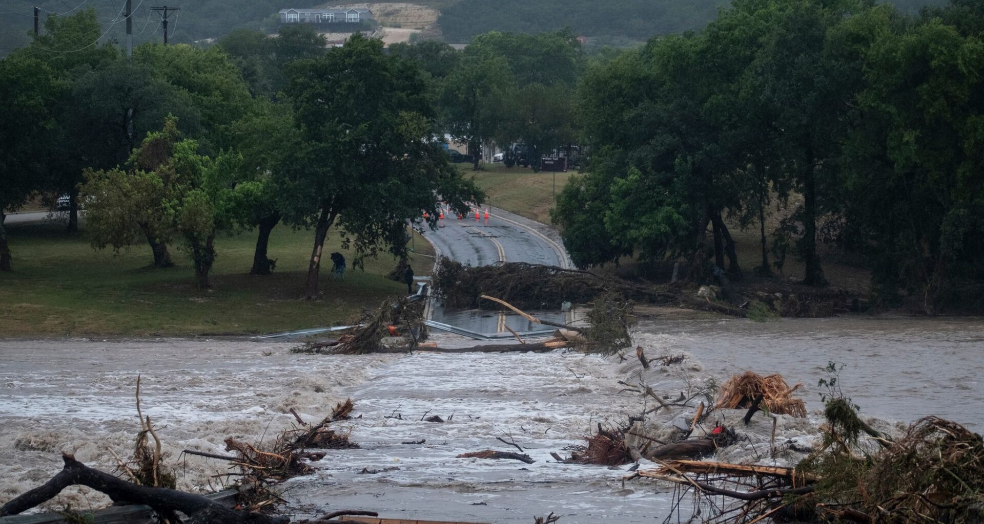 Texas flooding surges from storms as rescuers pull people from water