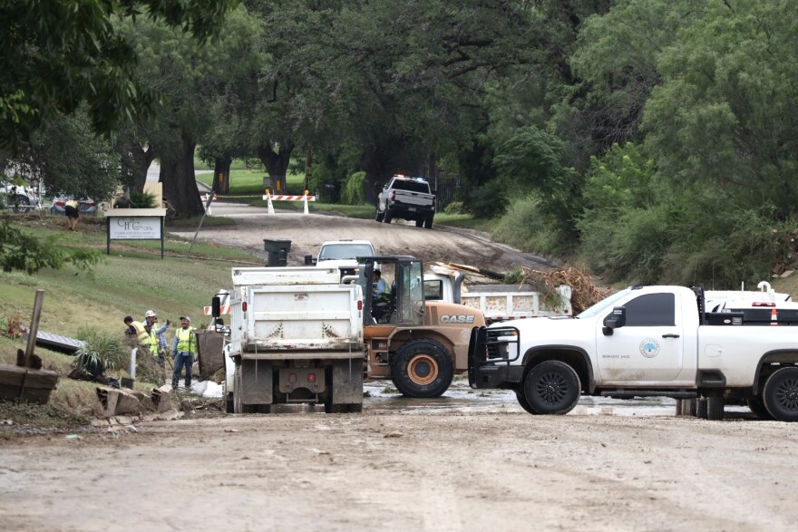 Recovery efforts continue in Uvalde on July 17, 2026, as crews remove debris and reopen roads damaged by severe flooding.