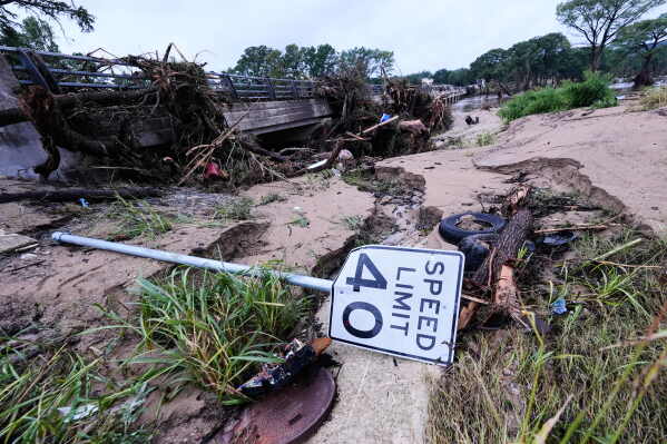 Storm debris is seen along the Guadalupe River on Friday, July 17, 2026, in Kerrville, Texas. (AP Photo/Gerald Herbert)