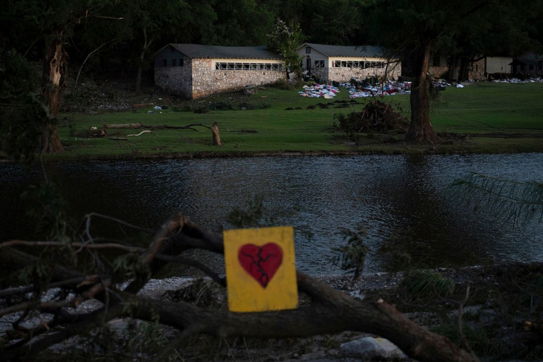 A broken heart sign is displayed near Camp Mystic July 8, 2025, after a flash flood swept through the area in Hunt, Texas.
