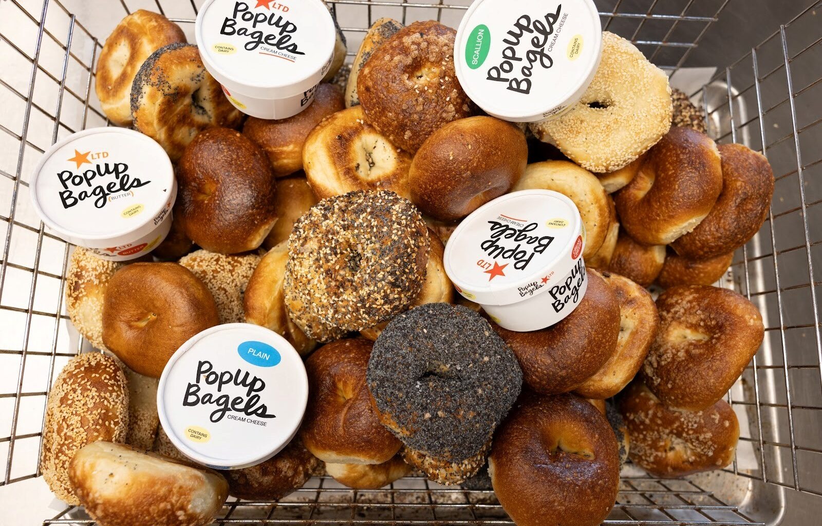 PopUp Bagels' famous bagels alongside cream cheese and butter schmears. 