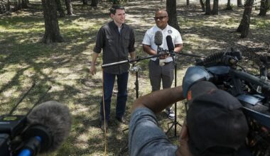 State Rep. James Talarico, the Democratic nominee for Senate (left), addresses reporters July 6 with state Rep. Venton Jones after they visited a West Dallas food pantry.