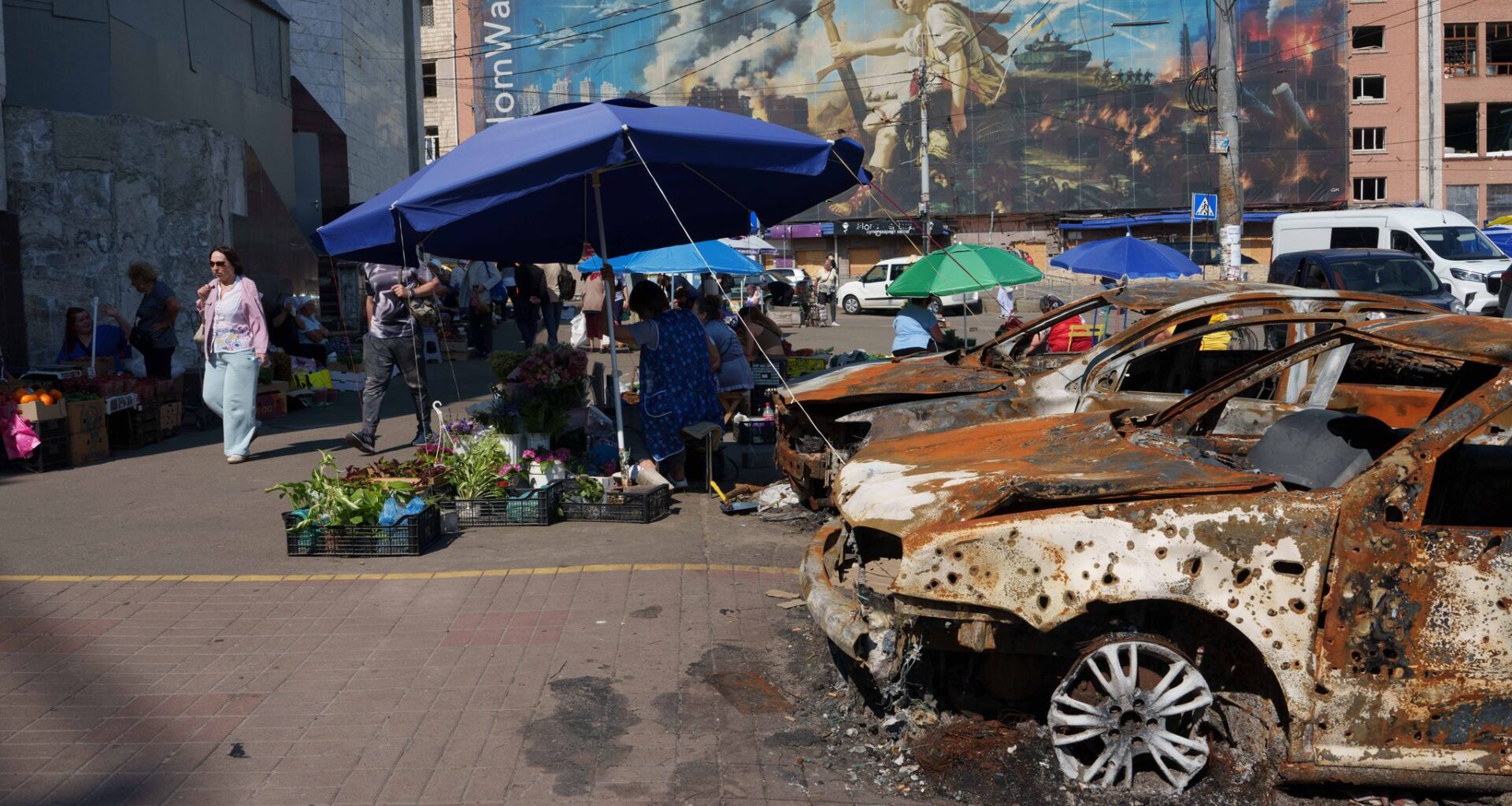 In one of Kyiv's most frequently bombed neighborhoods, residents choose to stay