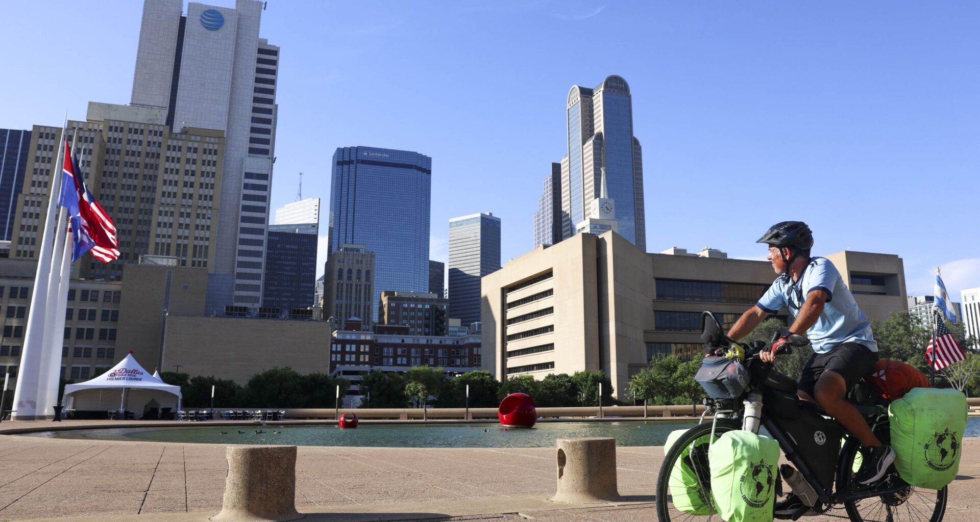 Juan Miguel Silio, 56, looks toward the Dallas skyline following his break at the Akard Plaza, on Thursday, May 14, 2026, in Dallas. 