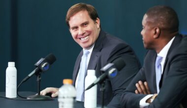 Dallas Mavericks forward Cooper Flagg poses for photos with his parents Kelly (left) and Ralph Flagg during a news conference after Flagg was named the 2025-26 NBA Rookie of the Year, Wednesday, April 29, 2026, in Dallas.
