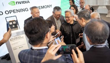 Wistron Chairman Simon Lin lifts his glasses to read a transcription on a gift to Nvidia founder and CEO Jensen Huang at an opening ceremony of a new state-of-the-art Wistron manufacturing facility that will assemble and test Nvidia AI systems in Fort Worth on Tuesday, July 21, 2026.