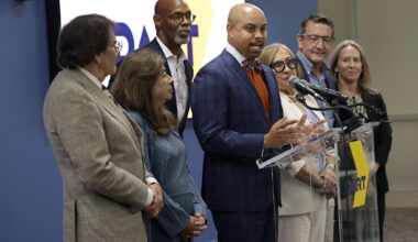 DART Board Chair Randall Bryant announces hiring Nathaniel Ford as their new CEO during a news conference at the DART Headquarters, Tuesday, July 21, 2026, in Dallas, with other board of directors.