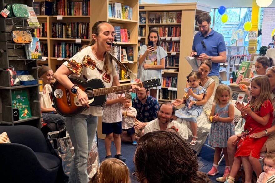 Singer Audrey Schott gives a musical performance at Interabang Books in Dallas.