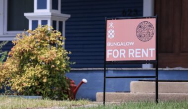 A sign advertises a house for rent in Dallas.