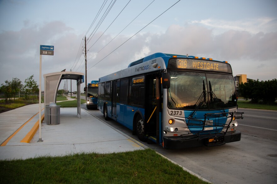 The CapMetro 318 Westgate bus parked at a bus stop at the Goodnight Ranch Park-and-Ride.