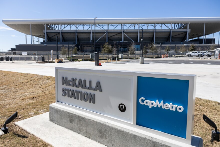 A sign that says, "McKalla Station, CapMetro" is shown in front of Q2 Stadium.
