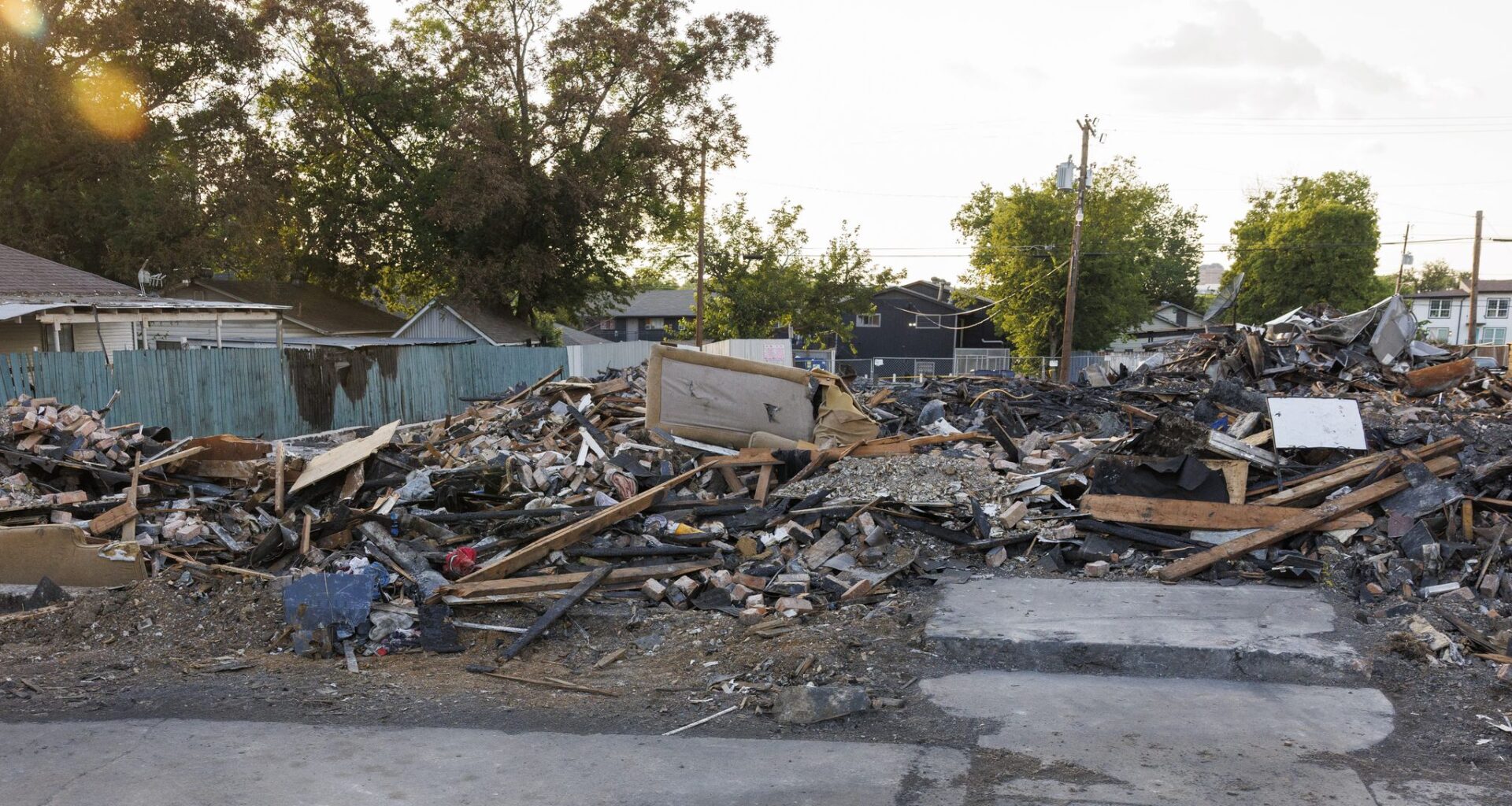 Debris from a deadly explosion and fire at The Clyde apartment building is seen in Oak Cliff on Wednesday, June 3, 2026, in Dallas. Three people were killed in the May 28 explosion and fire at the apartment building.