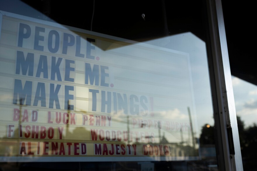 A sign for the Tiny Sounds event hangs inside of Alienated Majesty in Austin, Texas, on July 24, 2026. Lorianne Willett/KUT News