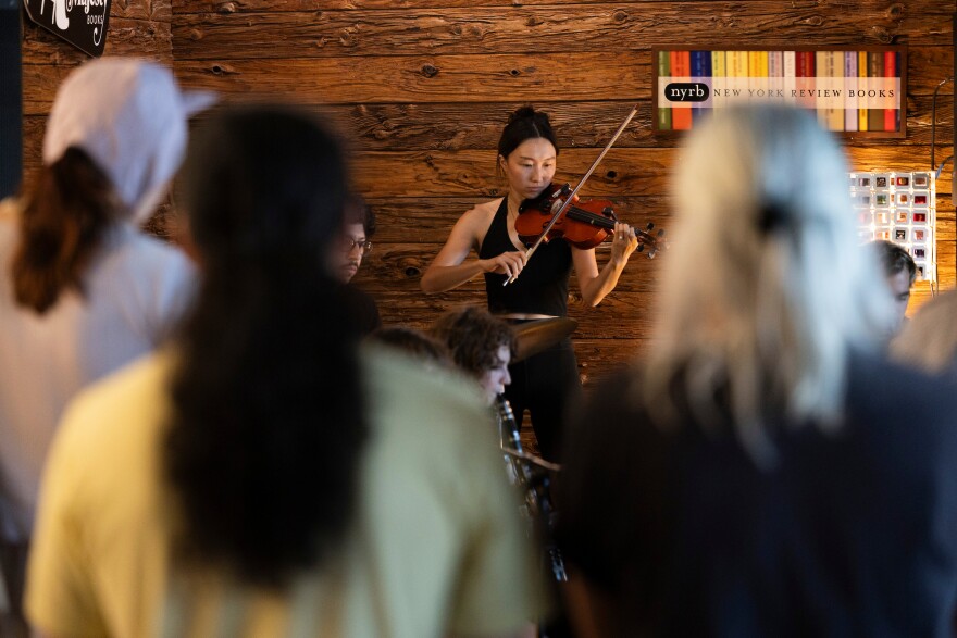 Michelle Zhang performs with band Woodcutter(s) inside of Alienated Majesty in Austin, Texas, on July 24, 2026. Lorianne Willett/KUT News