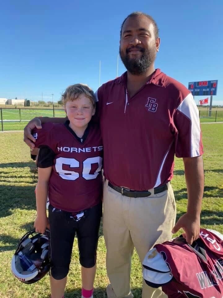 Flour Bluff's Ransom Watson as a youth football player with Danny Williams
