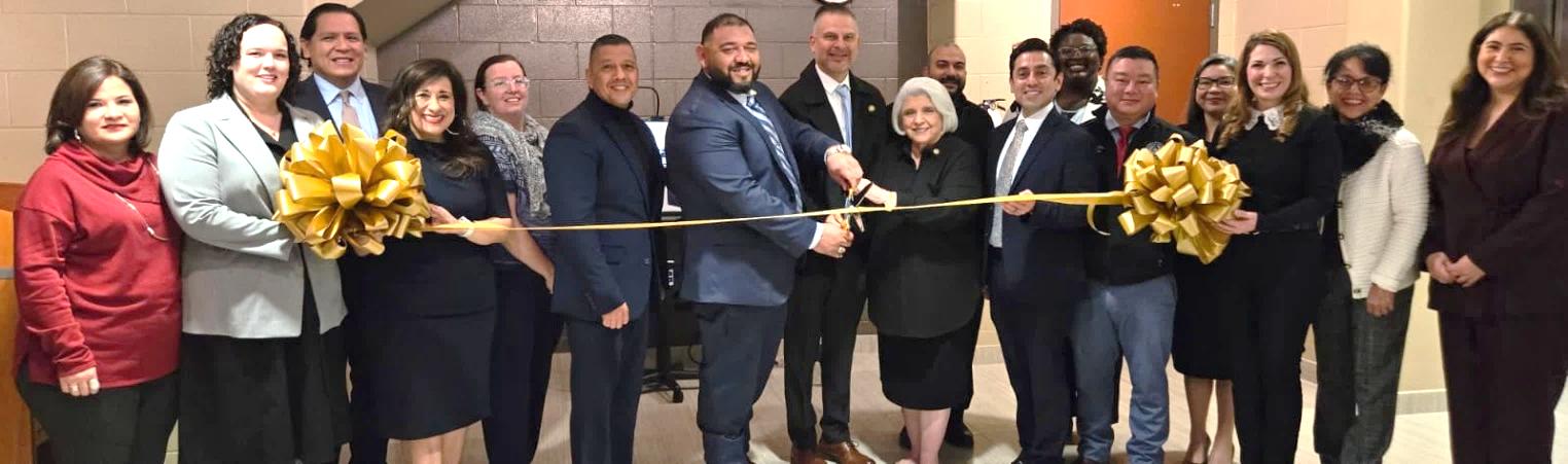 Dean Senator Judith Zaffirini cuts the ribbon for the new Legal Kiosk in South Laredo with (L-R) Webb County District Clerk Esther Degollado; Texas Rio Grande Legal Aid Attorney Caitlyn Fish; State Bar President Santos Vargas; Justice Toni Arteaga; Danielle Burns; JP Danny Dominguez; Council Members Ricardo Rangel and Gilbert Gonzalez; Andres Velazquez; Judge Victor Villarreal; DeV ondolyn Arrington, Texas Legal Services Center; Nathan Chu; Judge Gloria Lopez; Amber Holmes; Judge Leticia Martinez; and President Alyson Martinez, Texas Young Lawyers Association.