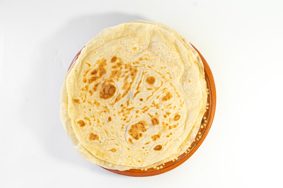 A tortilla sitting on top of a white table