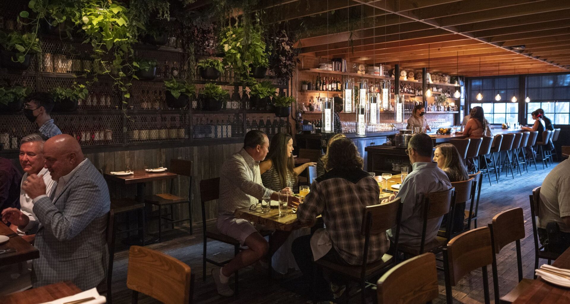 Spanish restaurant Masía in Dallas will have a modern, minimalist interior, as shown in this rendering. The restaurant is siblings with BCN Taste and Tradition in Houston, which has one Michelin star.