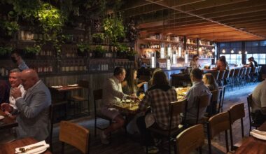 Spanish restaurant Masía in Dallas will have a modern, minimalist interior, as shown in this rendering. The restaurant is siblings with BCN Taste and Tradition in Houston, which has one Michelin star.