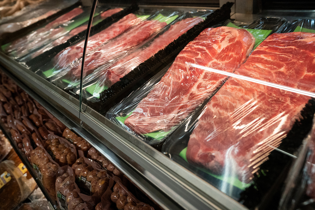A display case of various cuts of meat