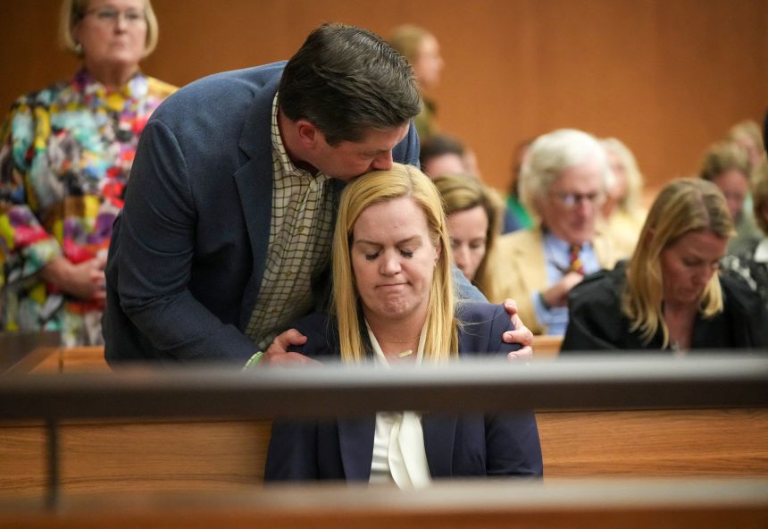 Camp Mystic Director Mary Liz Eastland is comforted at a hearing about a temporary injunction against her camp's reopening at the Travis County Courthouse in Austin, Texas, on March 4, 2026. Her husband, Edward Eastland, ran the portion of the camp that was housing the girls who died in the flood. His father, Dick Eastland, also died while trying to rescue some of the campers.