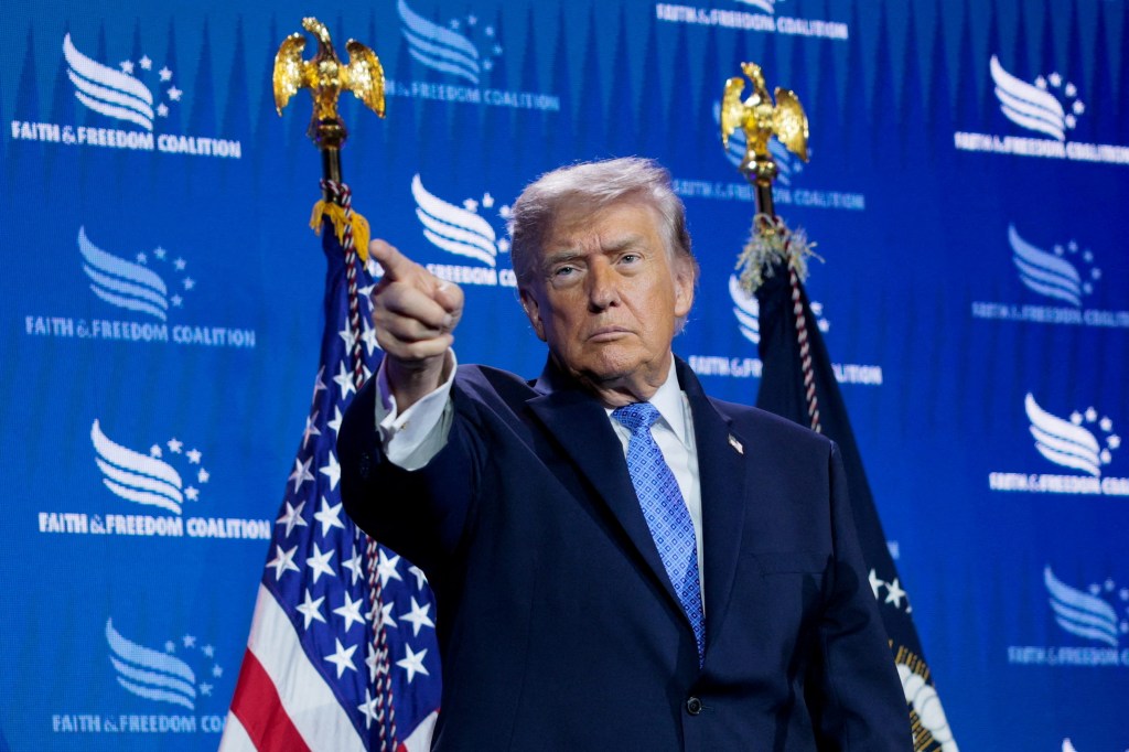 U.S. President Donald Trump points his finger at the Faith & Freedom Coalition's 2026 Policy Conference.