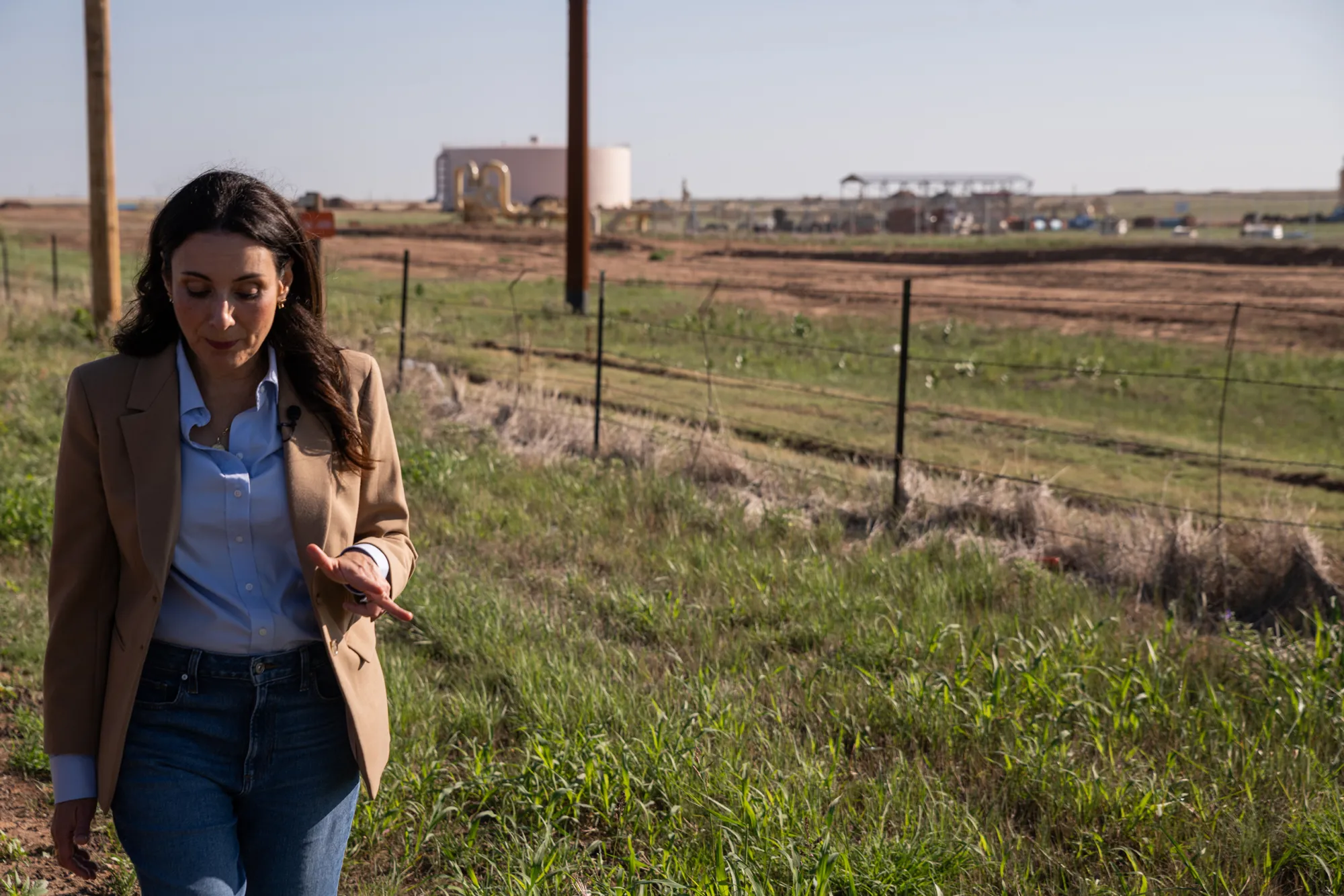 Gina Hinojosa walks the perimeter of the Fermi America Project Matador construction site on July 19, 2026.