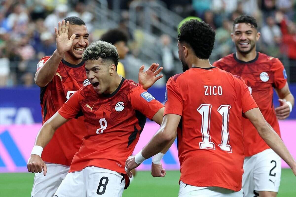 Egypt's midfielder #08 Emam Ashour (L) celebrates with teammates after scoring the opening goal during the 2026 World Cup round of 32 football match between Australia and Egypt at the Dallas Stadium in Arlington on July 3, 2026. (Photo by Thomas COEX / AFP via Getty Images)