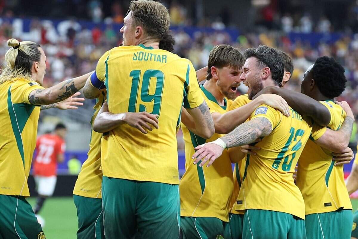 Australia's players celebrate after Egypt scored an own goal during the 2026 World Cup round of 32 football match between Australia and Egypt at the Dallas Stadium in Arlington on July 3, 2026. (Photo by Thomas COEX / AFP via Getty Images)