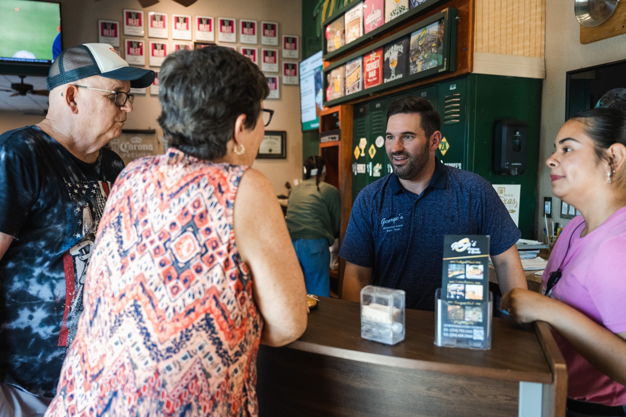 Owner of George’s Restaurant Kyle Citrano greets a couple from Florida in Waco, TX on June 25, 2026.